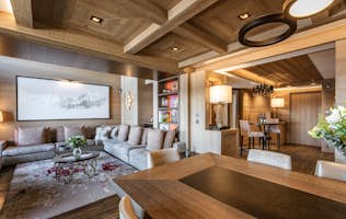 accommodation - Elixir - Modern and Cozy Living Room  accommodation - Elixir - This modern and cozy living room features elegant wooden design with a comfortable seating area and dining zone. The space is well-lit with sophisticated lighting and offers a welcoming atmosphere.
