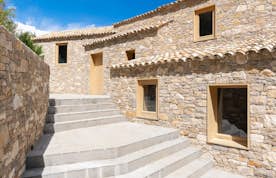 location - Printania - Stone House with Stone Stairs  location - Printania - This stone house features stone stairs leading to the entrance, offering a rustic and authentic charm.
