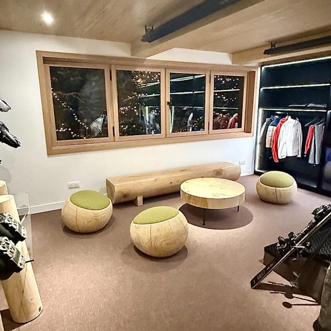 location - Les Arolles  - Modern gym with ski equipment  location - Les Arolles  - This modern gym is equipped with various ski equipment and wooden furniture. Ideal for winter sports enthusiasts.