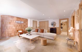 location - Les Arolles  - Modern and elegant living room with interior decoration  location - Les Arolles  - Discover this modern and elegant living room with refined interior decoration. The space is furnished with a comfortable sofa, a wooden coffee table, and decorative elements that add a touch of warmth and sophistication.