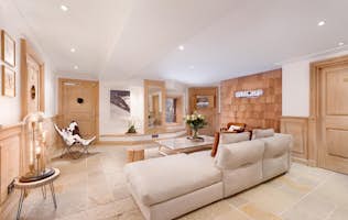 location - Les Arolles  - Modern and Bright Living Room  location - Les Arolles  - A modern and bright living room with designer furniture and natural wood elements.