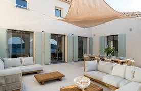location - Ancre - Lake View Terrace  location - Ancre - Modern outdoor terrace with elegant outdoor furniture offering a stunning lake view.