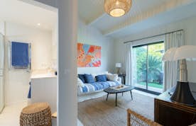 location - La Pausa - Modern Bedroom with Garden View  location - La Pausa - This modern bedroom offers a stunning garden view and is furnished with a comfortable bed, storage space, and contemporary decor.